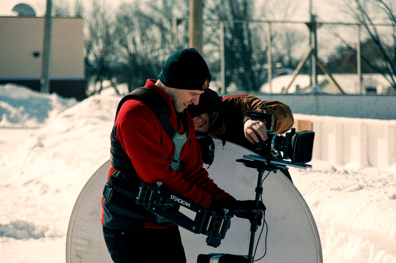 Students balance a stabilizer rig for a moving shot